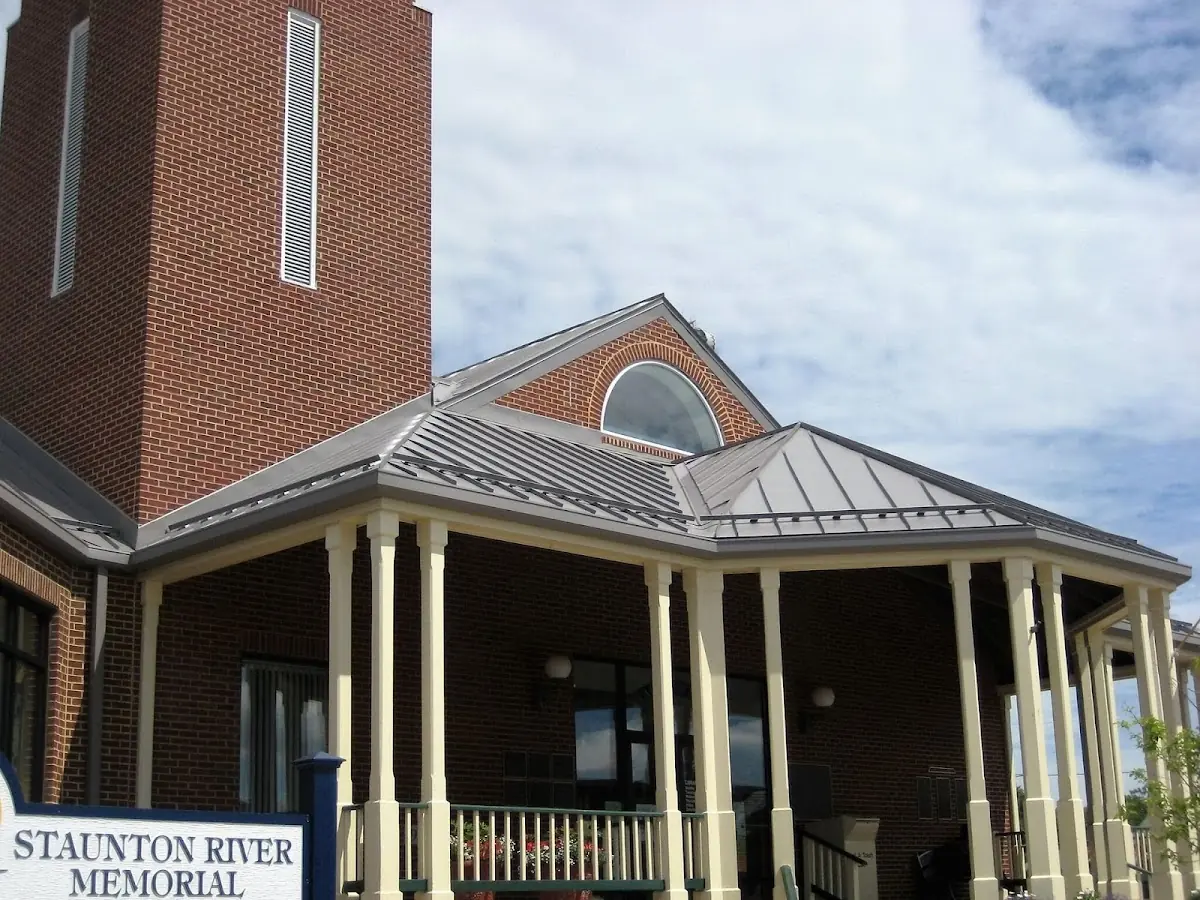 Skilled roofing craftsmen working on a residential roof in Broaddus